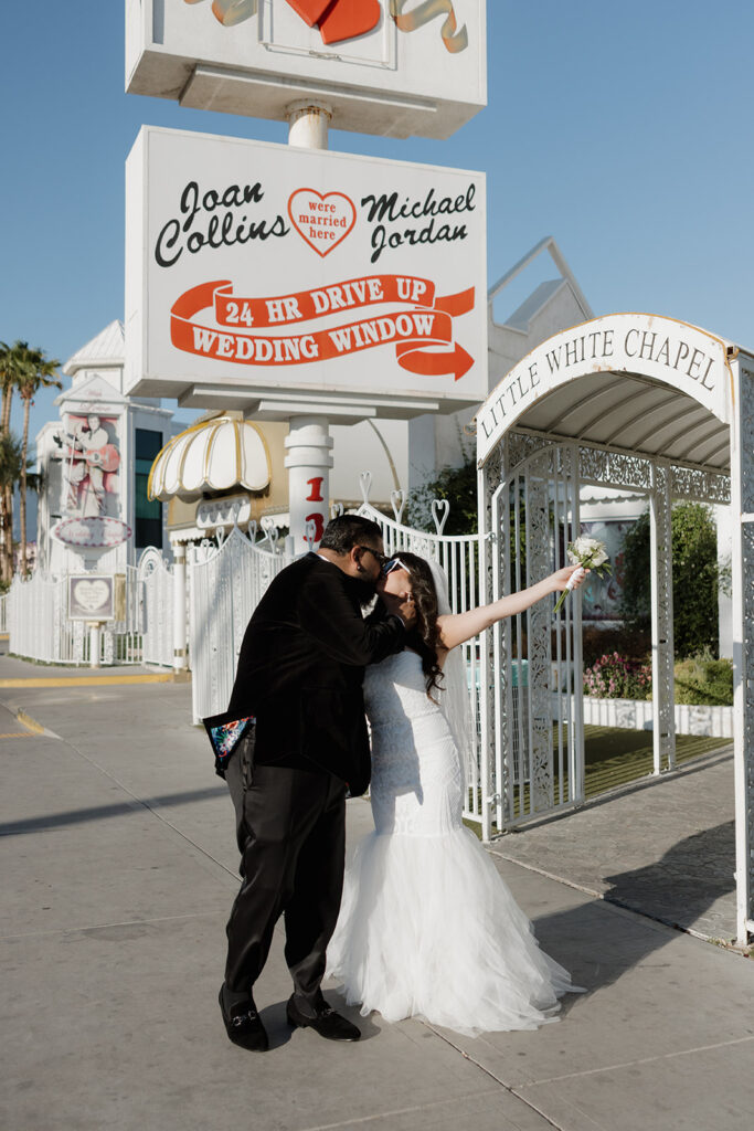 bride and groom celebrating at the little white wedding chapel