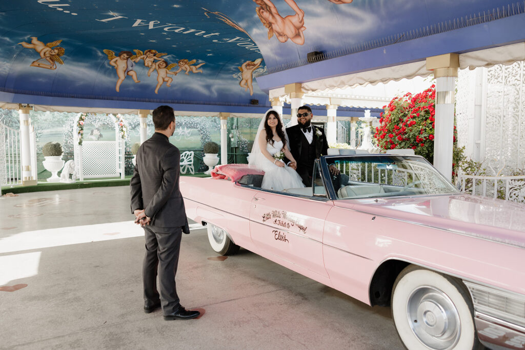bride and groom getting married in the tunnel of love at the little white Wedding chapel in las vegas nevada